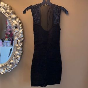 Black mini dress with sheer back panel